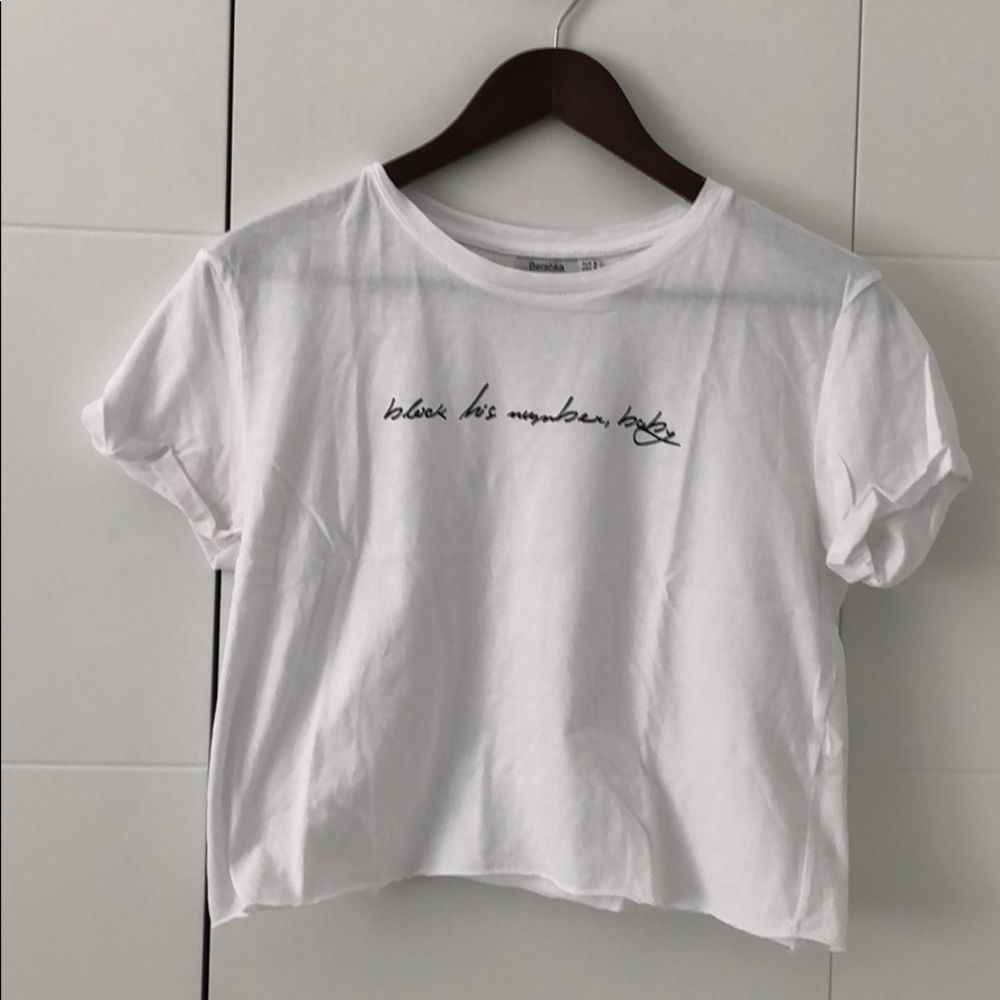 White cropped top with message on chest
